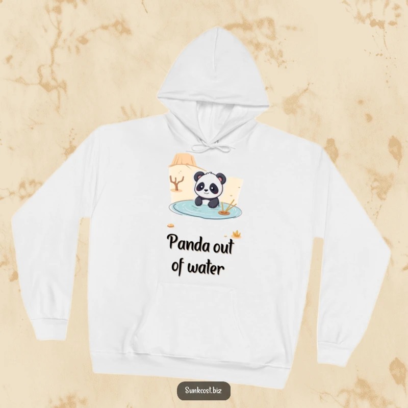 Funny hoodie with a playful panda comically attempting to swim in a dry desert, offering warmth and a dose of surreal humor.