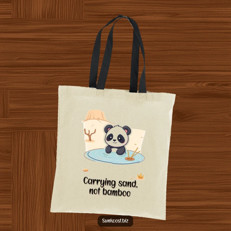 Funny tote bag depicting a playful panda comically trying to swim in a dry desert, ideal for shoppers who appreciate whimsical humor.